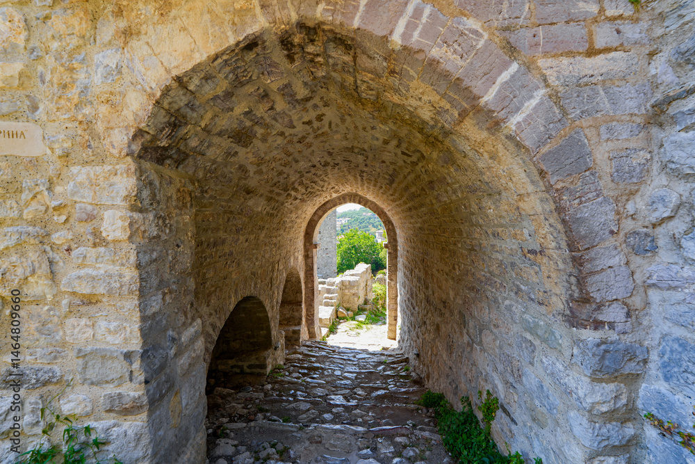Fototapeta premium Vaulted passageway in Stari grad Bar (Old Town of Bar), the ruins of an ancient walled city at the foot of Mount Rumija in Montenegro
