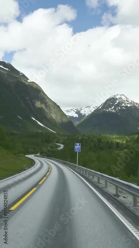 Vertical view of Norway road from car