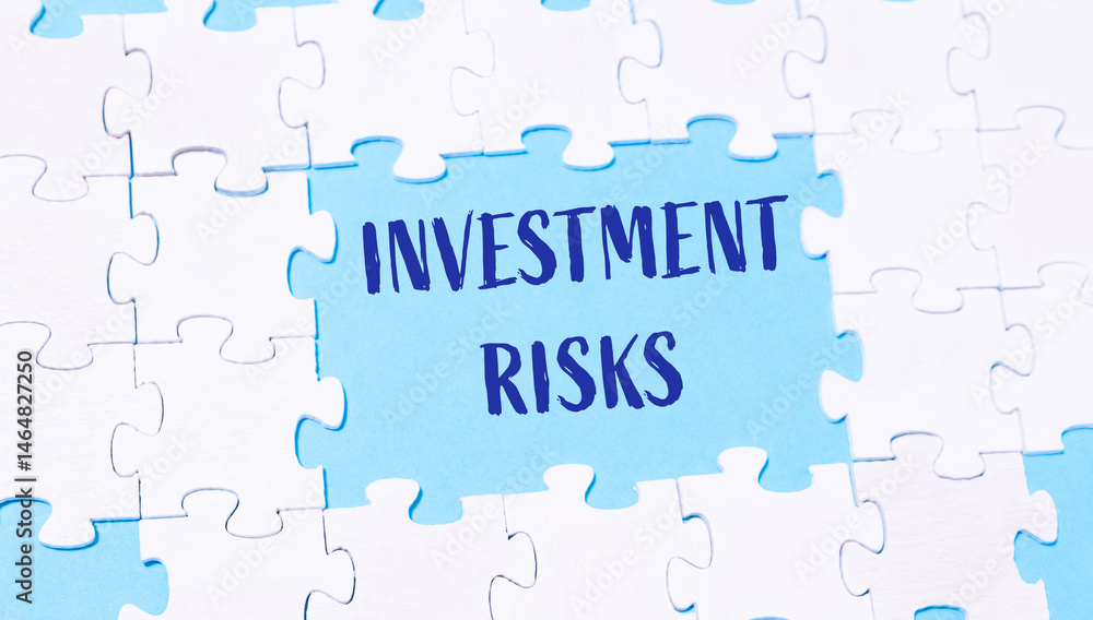 Puzzle with the word investment risks written in blue Puzzle with the word investment risks written in blue