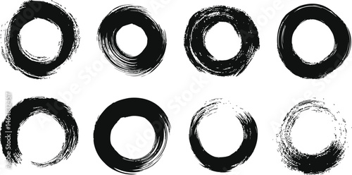 Set of eight black ink brush strokes in circular shapes, abstract design. Vector illustration