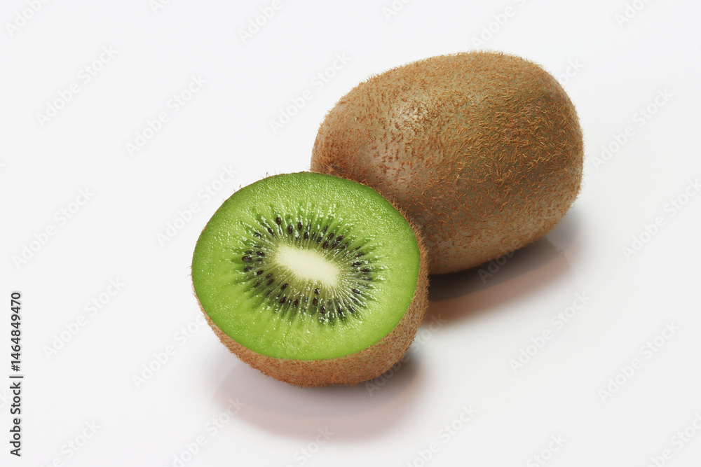 Fresh Kiwi fruit , sliced , halved on white background Fresh Kiwi fruit , sliced , halved on white background