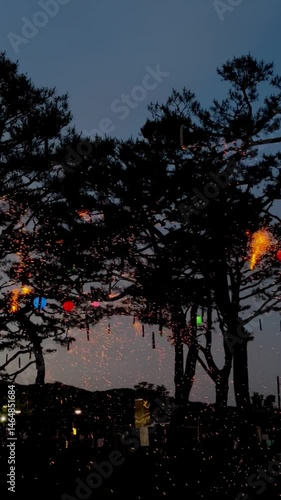 A Buddhist religious celebration involving a falling fireworks.