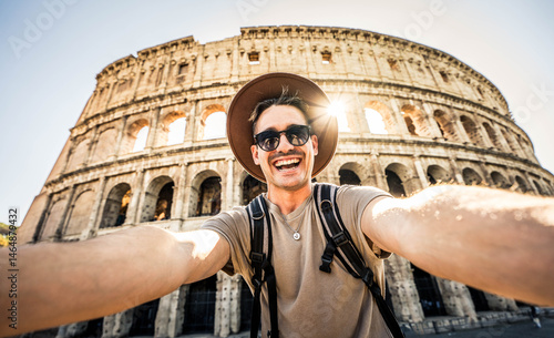 Photography Smiling tourist visiting Coloseum in Rome, Italy - Handsome young man taking sel