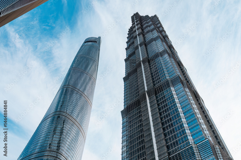 Fototapeta premium Looking up at the skyscrapers in downtown Shanghai