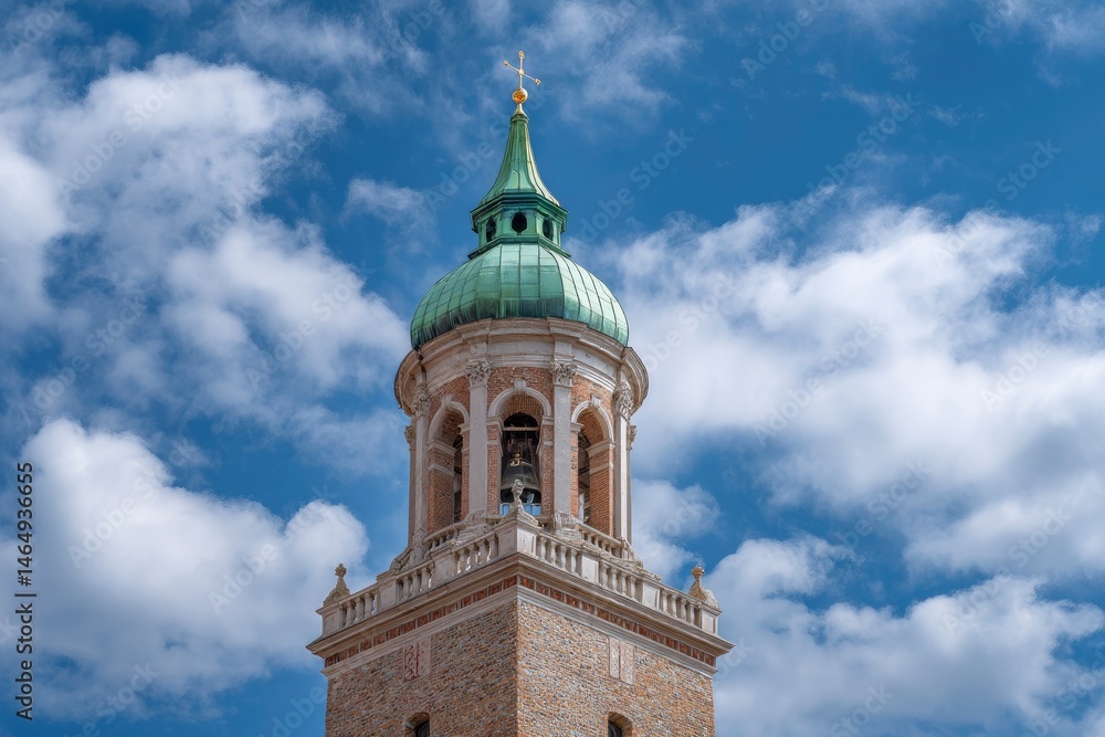 Fototapeta premium Elegant Church Bell Tower: Green Dome, Stone Facade, Blue Sky