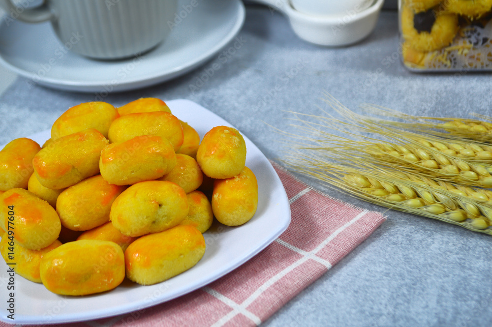 Nastar Cookies, Pineapple tarts or nanas tart are small, bite-size pastries filled or topped with pineapple jam, commonly found when Hari Raya or Eid Al Fitr or Lebaran. Selective focus
Nastar Cookies, Pineapple tarts or nanas tart are small, bite-size pastries filled or topped with pineapple jam, commonly found when Hari Raya or Eid Al Fitr or Lebaran. Selective focus