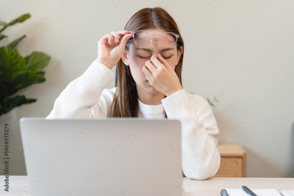 Eye problem concept, fatigue asian young woman tired eyes, irritated rubbing eye dry relief vision pain after work on laptop computer, eye strain, hand holding glasses, suffer migraine, bad blurry Eye problem concept, fatigue asian young woman tired eyes, irritated rubbing eye dry relief vision pain after work on laptop computer, eye strain, hand holding glasses, suffer migraine, bad blurry