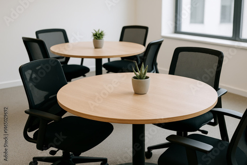 Round tables in modern coworking space – minimal close-up office interior
