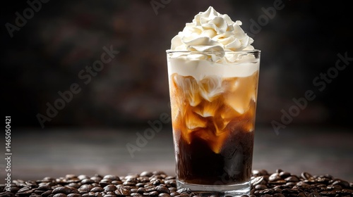 Tall glass of iced coffee with whipped cream on top