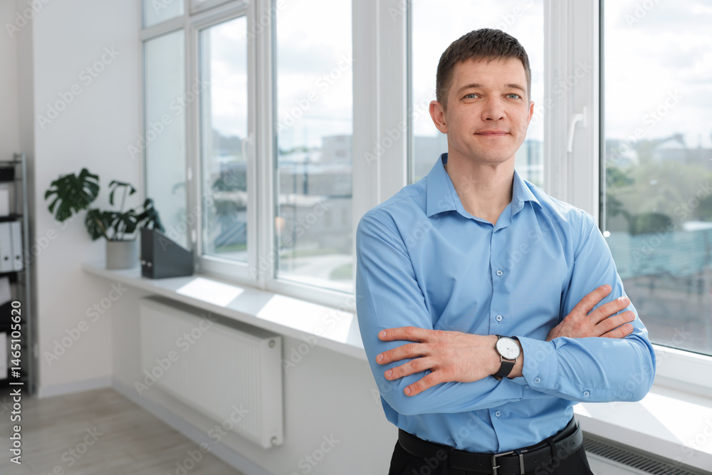 Portrait of handsome man near window indoors. Space for text Portrait of handsome man near window indoors. Space for text