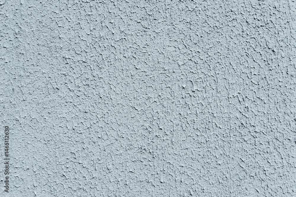 Close-up, background texture of a beige-white facade wall of a house made of decorative plaster. Abstract surface. Close-up, background texture of a beige-white facade wall of a house made of decorative plaster. Abstract surface.