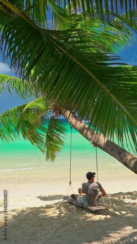 Beautiful tropical beach with scenery palm tree and crystal clear ocean on nature background 4K