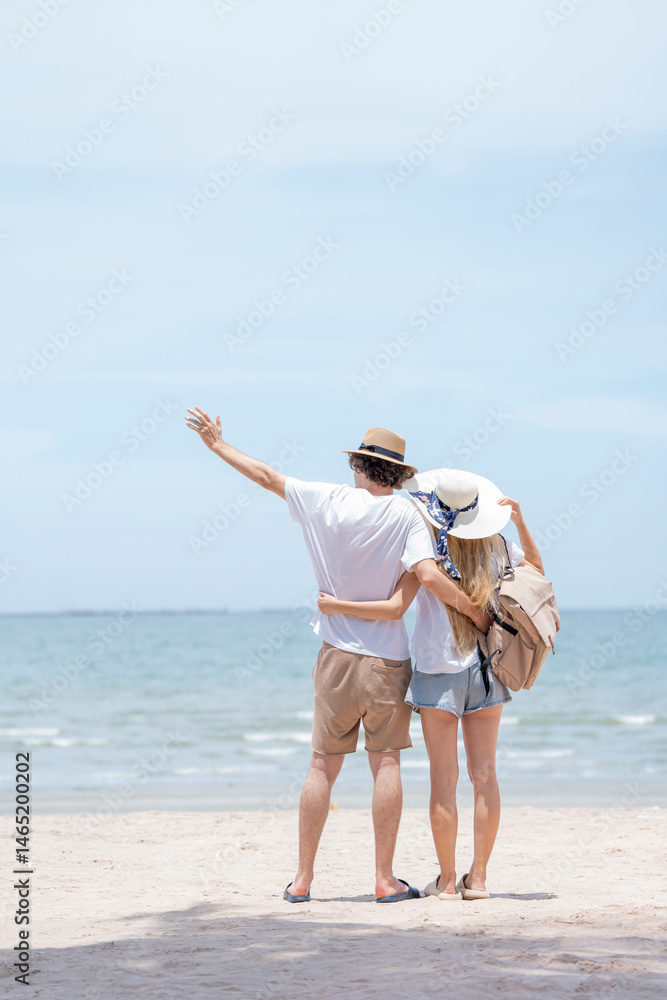 young couple enjoying at sea beach. Happy couple in love on beach summer vacations.
young couple enjoying at sea beach. Happy couple in love on beach summer vacations.