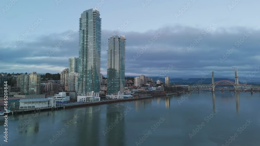New Westminster City Skyline at Dusk with the Fraser River and Bridge in British Columbia New Westminster City Skyline at Dusk with the Fraser River and Bridge in British Columbia