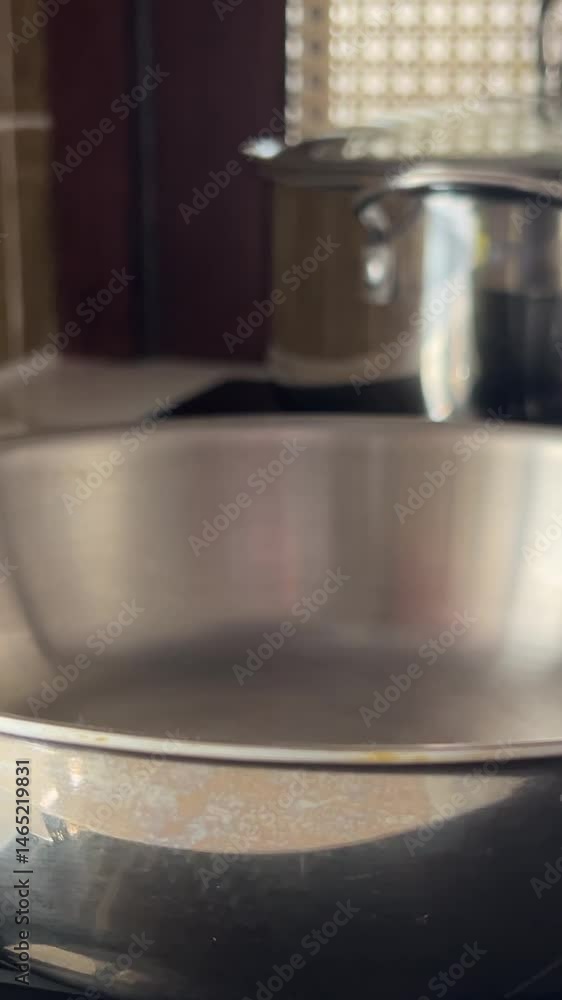 Stainless steel cookware and kitchen utensils on shelf, symbolizing culinary perfection, modern cooking techniques, Thanksgiving meal preparation. High quality 4k footage Stainless steel cookware and kitchen utensils on shelf, symbolizing culinary perfection, modern cooking techniques, Thanksgiving meal preparation. High quality 4k footage