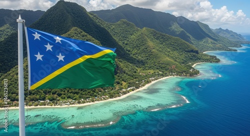 Waving Solomon Islands Flag Representing Sun and Sea Over Volcanic Hills and Turquoise Coastal Waters