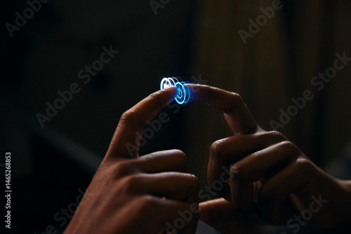 Hand of woman turning on light of digital mirror in bathroom