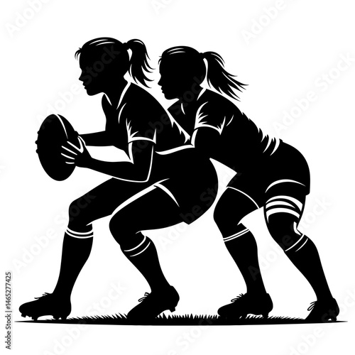 Two women playing rugby on grass field