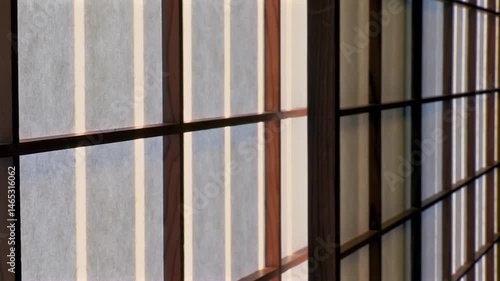 Wallpaper Mural Traditional Japanese shoji sliding doors with wooden frame and paper panels, soft light filtering through, minimal interior design, cultural architecture, serene atmosphere Torontodigital.ca