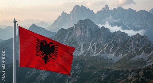 Waving Albanian Flag with Double-Headed Eagle Against the Dramatic Peaks of the Albanian Alps
