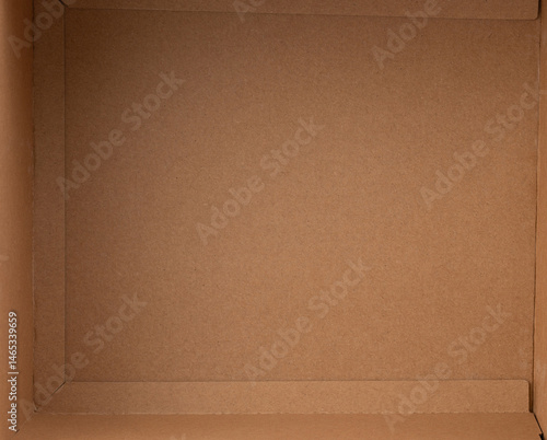 Obraz na płótnie Brown cardboard box positioned on neutral background for packaging purposes w salonie