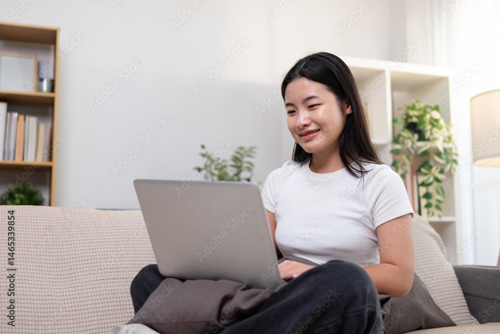 A young woman is using a laptop to search for information. A young woman is using a laptop to search for information.