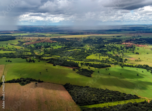 Obraz na płótnie Aerial view of Brazilian farmland under a stormy sky, showcasing agriculture and climate impact w salonie