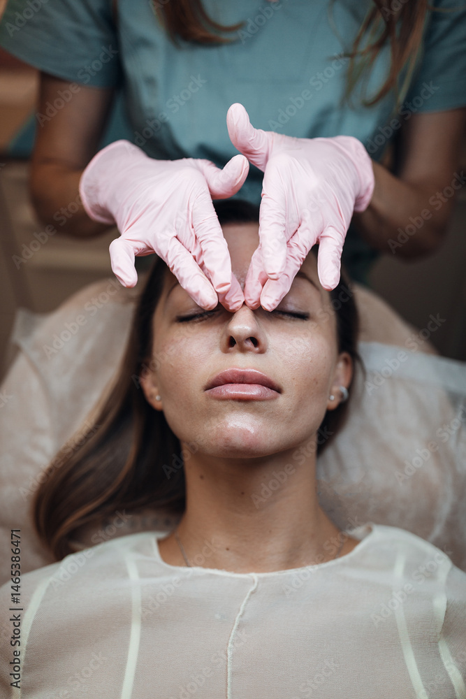 Naklejka premium Woman Receiving Botox Injection at Aesthetic Clinic