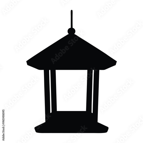 Silhouette of a traditional Japanese garden lantern with a peaked roof