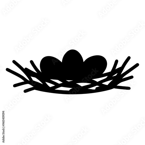 Black and white image depicting a bird's nest with three eggs