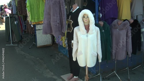 white fur coat with a hood at the market