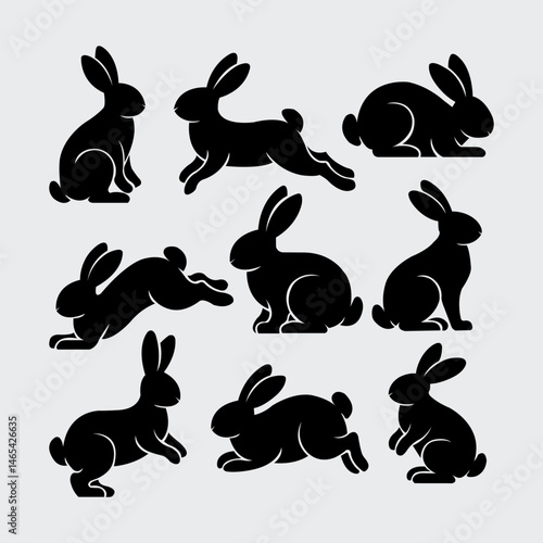 Set of rabbits silhouette in different poses. Hand drawn black silhouettes of easter bunnies isolated on white background.