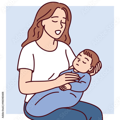 Young mother sitting and singing lullaby to her little baby son while holding him in arms, expressing tenderness love care emotional bonding, affection, happiness and calming presence during bedtime