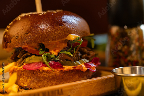 Closeup of hamburger and fries served at restaurant