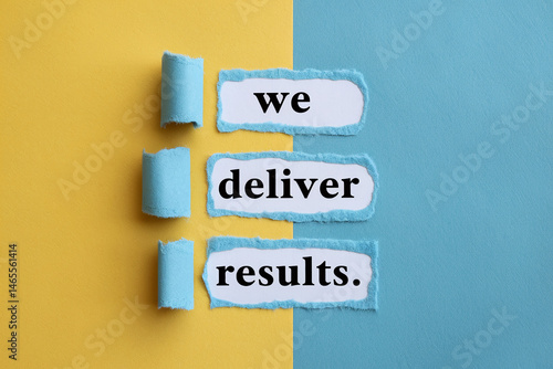 Torn blue paper reveals text: 