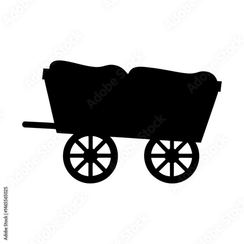 Silhouette of a hay cart farm vehicle with a full load of hay