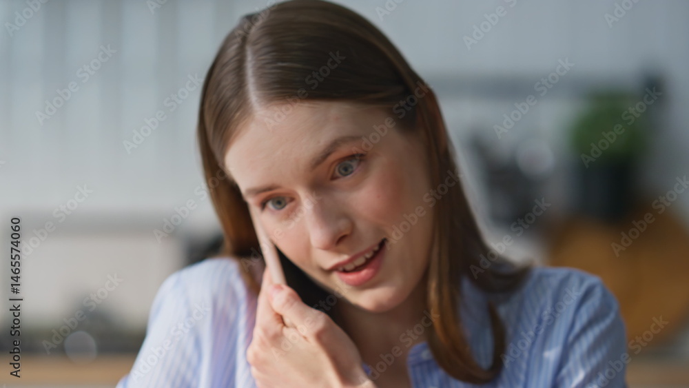 Woman enjoy cellphone communication in home office holding papers closeup.