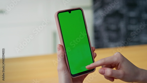Obraz na płótnie Girl fingers scrolling mockup smartphone browsing app in apartment closeup. w salonie