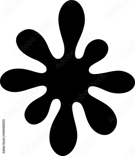Rounded ink splatter forming a petal-like splotch with soft edges and organic flow.