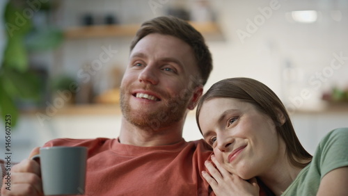 Obraz na płótnie Bonding couple resting couch enjoying tenderness closeup. Smiling husband wife w salonie