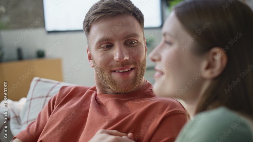 Smiling soulmates talking home couch sharing dreams closeup. Relaxed family