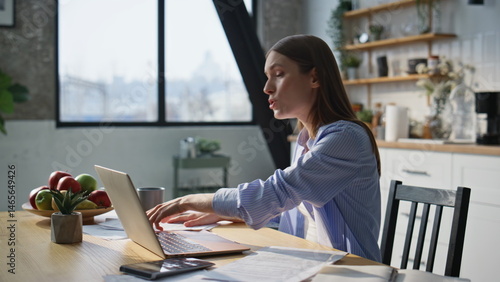 Woman boss arguing video meeting by laptop at home office closeup. Nervous lady