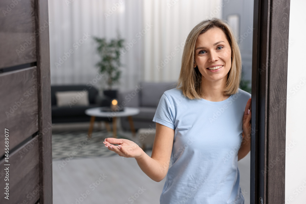 Happy woman welcoming guests to her house Happy woman welcoming guests to her house