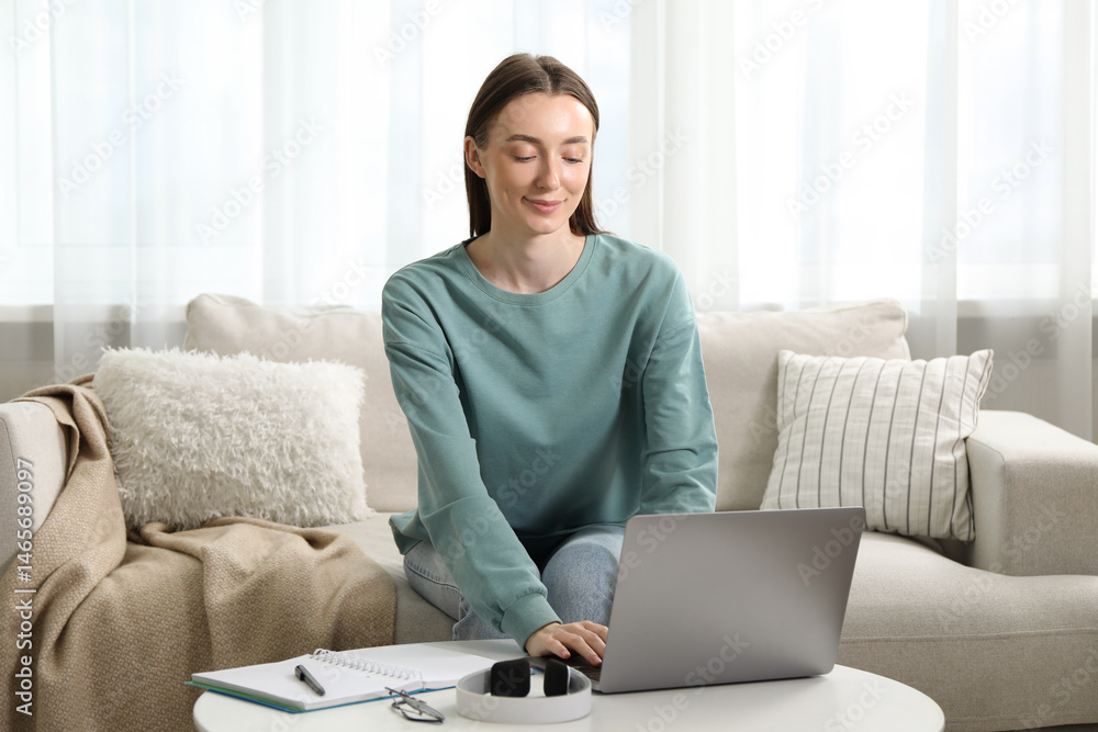 Woman learning online using laptop at table indoors. Self-study Woman learning online using laptop at table indoors. Self-study