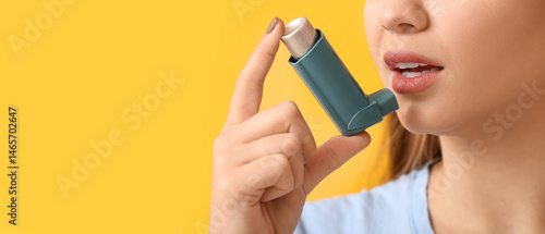 Young woman with inhaler ha...