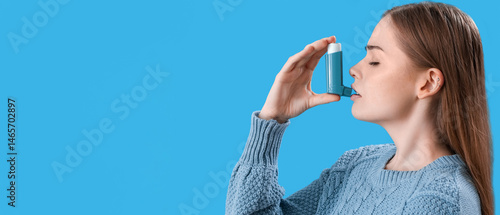 Sick young woman with inhal...