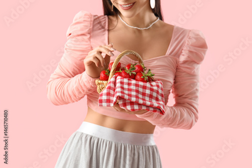 Young woman holding wicker ...