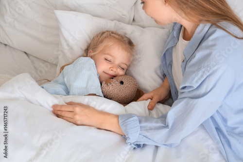 Cute little girl with toy b...