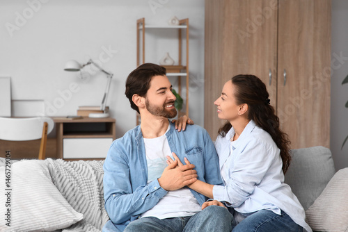 Married couple sitting on s...