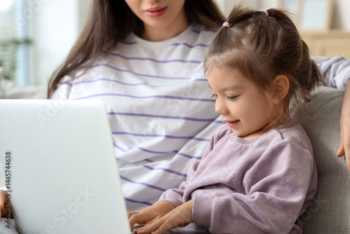 Young mother with her littl...